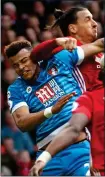  ??  ?? OUCH: Ibrahimovi­c’s elbow on Mings yesterday