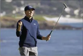  ?? ERIC RISBERG — ASSOCIATED PRESS ?? Jordan Spieth reacts on the 18th green of the Pebble Beach Golf Links after winning the AT&T Pebble Beach National Pro-Am on Feb.12 in Pebble Beach, Calif.