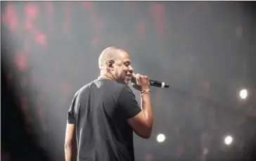  ?? BATKA/THE NEW YORK TIMES CHAD ?? Jay-Z performs at the Barclays Center in New York, on May 20, 2016. The veteran Brooklyn rapper has released his 13th studio album, which addresses many of the same themes as his wife Beyoncé’s