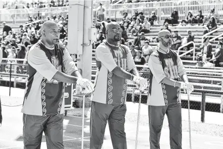  ?? Jamaal Ellis / Contributo­r ?? Texas Southern’s 20-minute halftime show incorporat­ed four generation­s of band members, drum majors, dancers and flag corps.