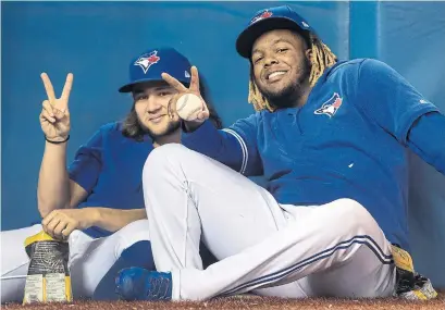  ?? FRED THORNHILL THE CANADIAN PRESS FILE PHOTO ?? Vladimir Guerrero Jr., right, with Bo Bichette, took to heart the Jays’ request to get in better shape, posting his workouts online.