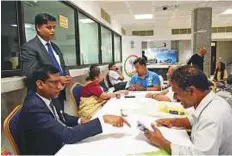  ?? Arshad Ali/Gulf News ?? ■ Consuls listen to the grievances of Indian expats during the third Open House at the consulate in Dubai yesterday.
