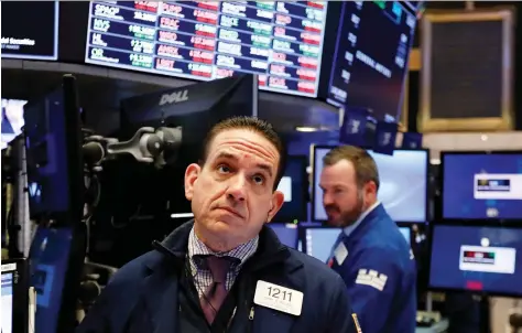  ?? RICHARD DREW/THE ASSOCIATED PRESS ?? A trader works on the floor of the New York Stock Exchange on Friday. The interestin­g thing about changing narratives is that often the underlying facts haven’t changed — the issue or concern has just been out of the spotlight, writes Tom Bradley.