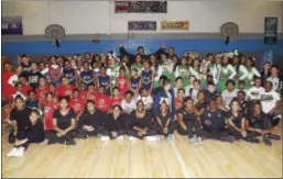  ?? GREGG SLABODA — TRENTONIAN PHOTO ?? Tim ‘Dog’ Gibson (back row center) presented his 3rd Annual Cheer/Dance Showcase on Saturday at the Centre St. Boys & Girls Club in Trenton.