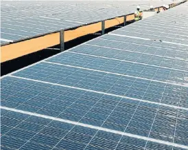  ?? /Reuters ?? Capacity cap: Solar panels and other forms of independen­t electricit­y generation require a licence from the National Energy Regulator of SA if they generate more than 1MW.