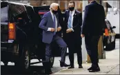  ?? PHOTOS BY ANDREW HARNIK — THE ASSOCIATED PRESS ?? President-elect Joe Biden, wearing a medical boot, leaves his motorcade Tuesday as he arrives at The Queen theater in Wilmington, Del.