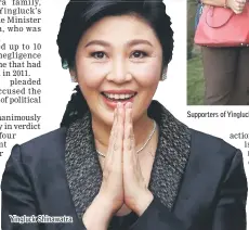  ??  ?? Yingluck Shinawatra Supporters of Yingluck gather outside the court ahead of verdict in her trial for negligence, in Bangkok. — AFP photo