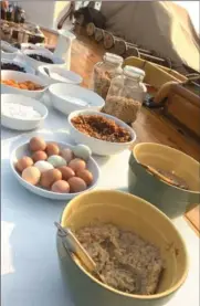  ??  ?? Every morning, Annie Mahle, the captain and chef, sets out an elaborate breakfast on deck.