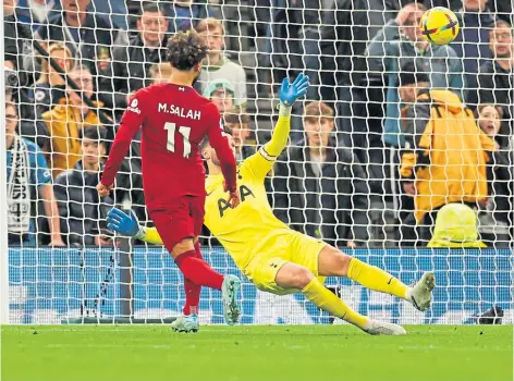  ?? ?? WINNER: Liverpool’s Mo Salah was on hand to exploit a Spurs mistake to make it 2-0 for the Reds in the first half.