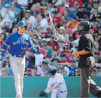  ?? WINSLOW TOWNSON/THE ASSOCIATED PRESS ?? Toronto’s Troy Tulowitzki tosses his bat past home plate umpire Manny Gonzalez after lining out Monday as the Red Sox put an 11-4 beating on the Blue Jays.