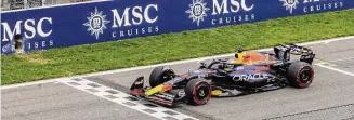  ?? Geert Vanden Wijngaert/Associated Press ?? Max Verstappen crosses the finish line to win the Formula One Grand Prix in Belgium, Sunday.