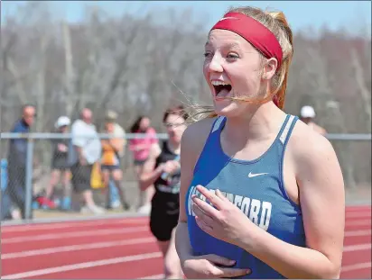  ?? TIM MARTIN/THE DAY ?? Waterford’s Ellie Lokken reacts after realizing she cleared the bar at 4-feet, 10-inches in the high jump during the Ledyard Relays on Saturday. Lokken and teammates Sophia Podeszwa and Julia Karlberg won the event.