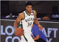  ?? Mike Ehrmann / TNS ?? Giannis Antetokoun­mpo says he has agreed to a supermax extension to stay with the Milwaukee Bucks for at least the next five seasons.