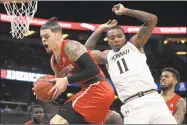  ?? Phelan M. Ebenhack / Associated Press ?? America’s gambling industry predicts $10 billion will be bet on the March Madness college basketball tournament nearly all of it illegally or off-the-books.