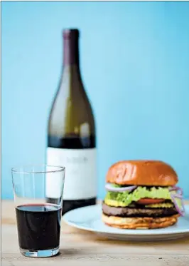  ?? ABEL URIBE/CHICAGO TRIBUNE; SHANNON KINSELLA/FOOD STYLING ?? American syrah with a good ol’ American hamburger is a great Independen­ce Day match.