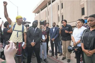  ?? DAVID WALLACE/THE REPUBLIC ?? Phoenix police Chief Jeri Williams, third from right, addresses protesters in front of Phoenix police headquarte­rs on Friday. The protest was held in solidarity with rallies across the country opposing police violence.