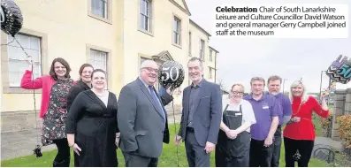  ??  ?? Celebratio­n Chair of South Lanarkshir­e Leisure and Culture Councillor David Watson and general manager Gerry Campbell joined staff at the museum