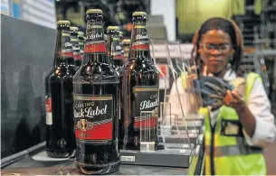  ?? Picture: BLOOMBERG ?? PRODUCTION LINE: AB InBev is hoping to wrap up its takeover of SABMiller by the second half of the year and prides itself on its efficiency