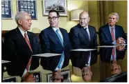  ?? J. SCOTT APPLEWHITE / AP ?? (From left) Senate Finance Committee Chairman Orrin Hatch, R-Utah; Treasury Secretary Steven Mnuchin; President Donald Trump’s top economic adviser, Gary Cohn; and Sen. Rob Portman, R-Ohio, are working to get the first major rewrite of the U.S. tax...