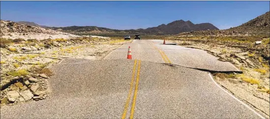  ?? Brian Olson California Geological Survey ?? A RUPTURED road at Naval Air Weapons Station China Lake. A quake on the Garlock fault could lead to strong shaking there and at other important military bases.