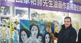  ?? CUI XIAO / FOR CHINA DAILY ?? French artist Christian Poirot donates five of his paintings on comfort women to the Nanjing Museum of the Site of Lijixiang Comfort Stations in Nanjing, Jiangsu province in December.