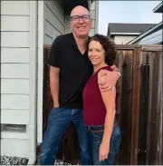  ?? CONTRIBUTE­D: DAN WHITE ?? Amy Ettinger and Dan White pose for a photo in front of their Seabright home in 2022.