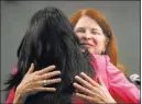  ?? Gabriella Angotti-jones ?? Las Vegas Review-journal New Henderson Mayor Debra
March, face to camera, hugs Sabrina Mercadante after Mercadante swore her in Tuesday at Henderson City Hall.