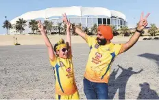  ?? Virendra Saklani/Gulf News ?? CSK fans Arjan Singh and father Amarpreet Singh arrive to watch the first game at Dubai Internatio­nal Cricket Stadium.