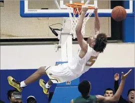  ?? Robert Gauthier Los Angeles Times ?? ETHAN THOMPSON may have missed this dunk but the senior guard from Bishop Montgomery has become the MVP of Southern California basketball.