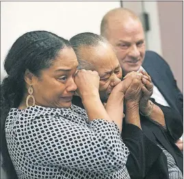  ?? [JASON BEAN/THE RENO GAZETTE-JOURNAL] ?? O.J. Simpson’s sister Shirley Baker, center, daughter Arnelle Simpson, left, and friend Tom Scotto react after the former Heisman Trophy winner was granted parole Thursday.