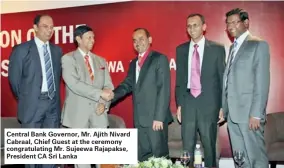  ??  ?? Central Bank Governor, Mr. Ajith Nivard Cabraal, Chief Guest at the ceremony congratula­ting Mr. Sujeewa Rajapakse, President CA Sri Lanka