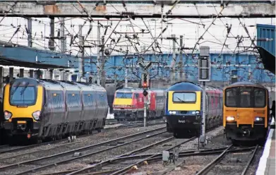  ?? MARK PIKE. ?? Four trains with four different operators at Doncaster on February 12, as (from left to right): a CrossCount­ry Class 220 waits to leave with a northbound service; an LNER Mk 4 Driving Van Trailer tails a northbound express; Hull Trains 43165 heads south with the 0907 Hull Botanic Gardens-St Philips Marsh; and Northern 150138 waits to depart south. Under Network Rail plans there will be five regions with 13 routes.