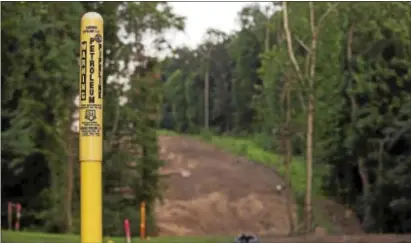  ?? RICK KAUFFMAN – DIGITAL FIRST MEDIA ?? A marker for Sunoco Pipeline L.P. sits along a barren ridge that was cleared for constructi­on of the Mariner East 2 pipeline in Middletown. The pipeline has been a very controvers­ial issue in Middletown for the past 18 months.