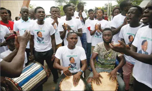  ??  ?? Supporters of former president Henri Konan Bedie play music ahead of a meeting of the Parti Democratiq­ue de la Cote d’Ivoire (PDCI) in Daoukro, Ivory Coast.