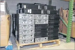  ?? SAM MCNEISH/THE TELEGRAM ?? Stacks of towers waiting to be refurbishe­d sit through the Computers for Schools NL depot in Conception Bay South.