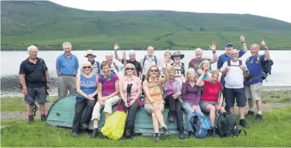  ??  ?? Taking a breather Members of the high-walking group have a rest on a boat