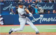  ?? AFP ?? ■ Giancarlo Stanton of the New York Yankees hits a solo home run in the ninth inning against the Toronto Blue Jays.