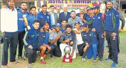  ?? HT PHOTO ?? Uttar Pradesh Cricket Associatio­n players pose after winning the Justice SN Dwivedi AllIndia cricket tournament in Allahabad on Wednesday.