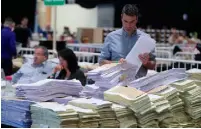  ??  ?? FROM TOP: Jackie Healy Rae Jnr and his father Michael at the count centre in Killarney, Co Kerry; Roisin Shortall of the Social Democrats in Dublin’s RDS; Sorting ballot papers in the RDS