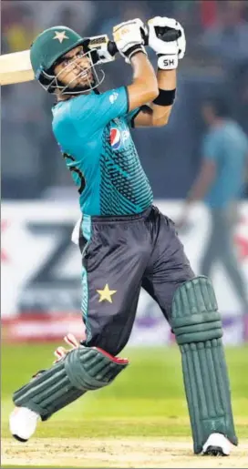  ?? AP ?? Pakistan batsman Babar Azam hits a boundary against the World XI during the first Twenty20 at the Gaddafi Stadium in Lahore on Tuesday.