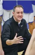  ?? STAFF FILE PHOTO BY C.B. SCHMELTER ?? John Shulman talks to McCallie basketball players during a home game this season. After winning 100 games in his four seasons as coach of the Blue Tornado, Shulman has resigned.