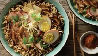  ?? PHOTOS BY MICHAEL TERCHA, TNS ?? Grilled shichimi togarashi-flavoured chicken and soy-wasabi hard-cooked eggs bolster homemade ramen.