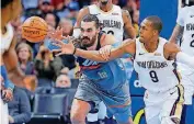  ?? [PHOTO BY BRYAN TERRY, THE OKLAHOMAN] ?? Oklahoma City’s Steven Adams (12) battles for the ball against New Orleans’ Rajon Rondo (9) during a February game at Chesapeake Energy Arena. Rondo is leaving New Orleans to join the Los Angeles Lakers and LeBron James.