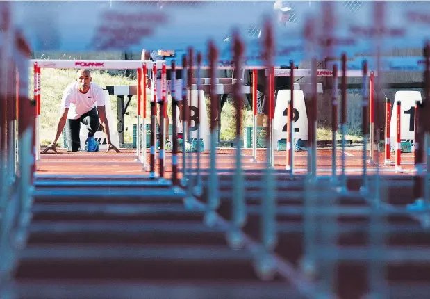  ?? GERRY KAHRMANN ?? Damian Warner warms up prior to competing in the 110-metre hurdles at the Harry Jerome Track Classic at Swangard Stadium in Burnaby Tuesday. He went on to finish second in the decathlon event. He is aiming to improve in the pole vault under the...