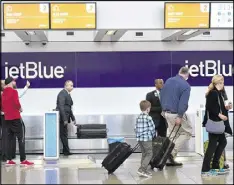  ?? HYOSUB SHIN / HSHIN@AJC.COM ?? JetBlue plans to expand with more flights from Atlanta to New York, Fort Lauderdale and Orlando later this year. The airline says it has struggled to get the gate space it wants to grow in Atlanta.