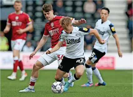  ?? Picture: Nigel Roddis/Getty ?? Bristol City’s Alex Scott puts Derby’s Liam Thompson under pressure