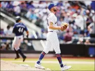  ?? Mike Stobe / Getty Images ?? The Mariners’ Julio Rodriguez (44) rounds third base after hitting a home run to left field in the sixth inning as the Mets’ Chasen Shreve looks on Sunday.