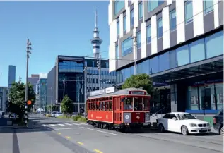  ?? ROBERT SWEET ?? With the Auckland Sky Tower in the background tram 466 is seen on the Dockline route on August 28. This tram was built in 1926 in Melbourne, Australia and prior to entering preservati­on worked there as part of the fleet of X1 type trams.
