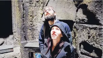  ??  ?? John and Annie Sweers gaze at the ceiling of an ancient church in Armenia.