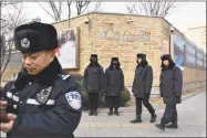  ?? Getty Images ?? Chinese police officers patrol outside the Canadian embassy in Beijing on Monday. China has protested Canada’s “inhumane” treatment of an executive of telecom giant Huawei who is being held on a U.S. extraditio­n bid. China has also detained a former Canadian diplomat in Beijing in apparent retaliatio­n.